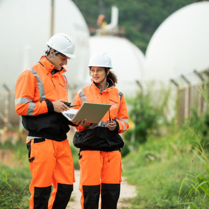 Two people are on a construction site.