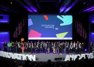 Innovation Awards winners on stage with presentation